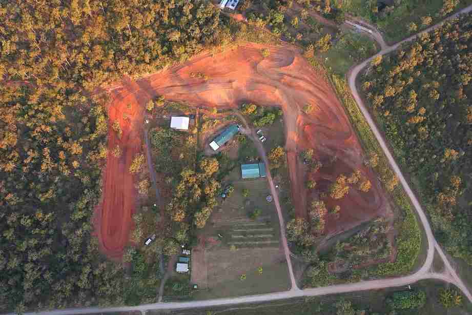 Aerial view of a red dirt motocross track