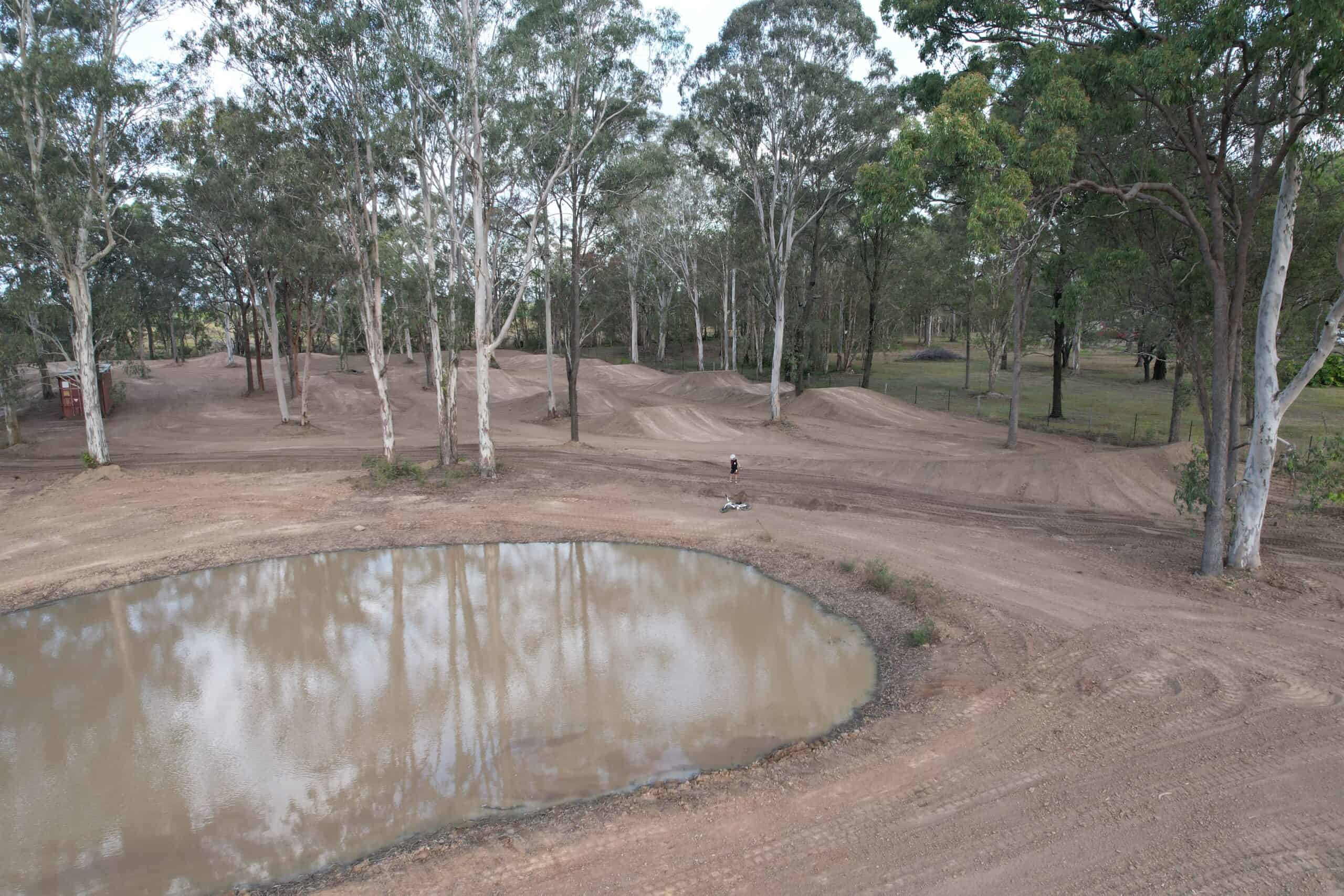 Cleared land with a puddle in the middle